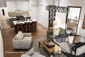 Modern kitchen and cozy living space in the in-law suite of the Legacy Barndominium, featuring a central island, pendant lighting, and open-concept layout.