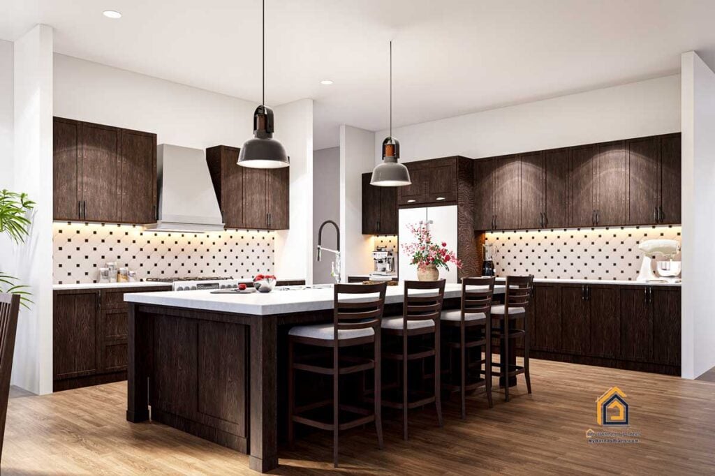 Spacious kitchen in the Legacy Barndominium featuring dark wood cabinetry, a large island with bar seating, and modern tile backsplash