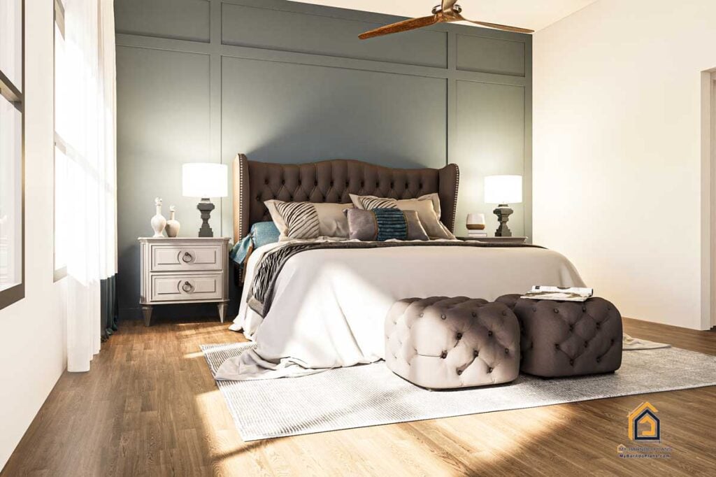 Elegant master bedroom in the Legacy Barndominium, showcasing a tufted headboard, matching ottomans, and accent wall with modern paneling.