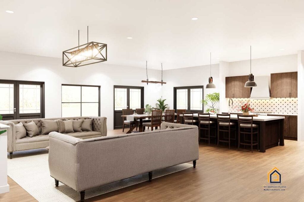 Expansive open-concept living area in the Legacy Barndominium, connecting the living room, dining space, and kitchen with seamless flow and high-end finishe