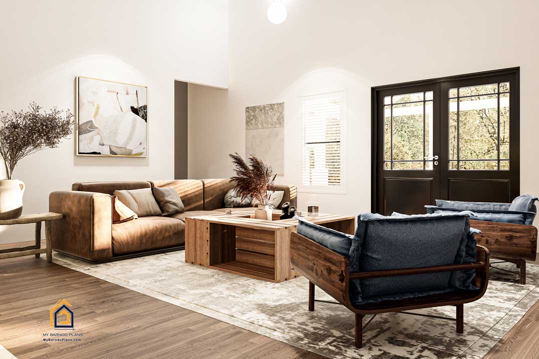Warm and welcoming living room in the Summit Barndominium showcasing plush sofas, stylish wooden furniture, artistic decor, and double doors opening to outdoor views.