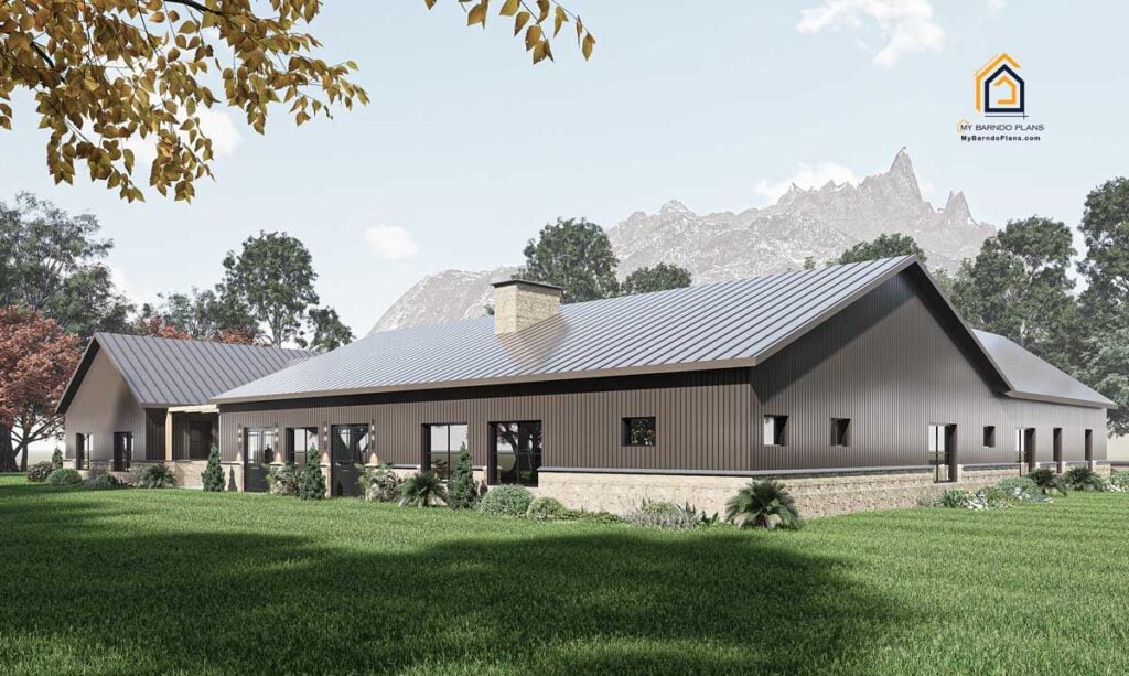 Back view of the Legacy Barndominium highlighting its long single-story layout, multiple windows, and stone wainscoting against a mountain backdrop.