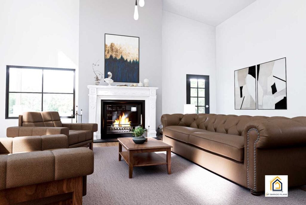 Warm and inviting living room inside The Arcadia barndominium with a fireplace, brown tufted furniture, and high ceilings.