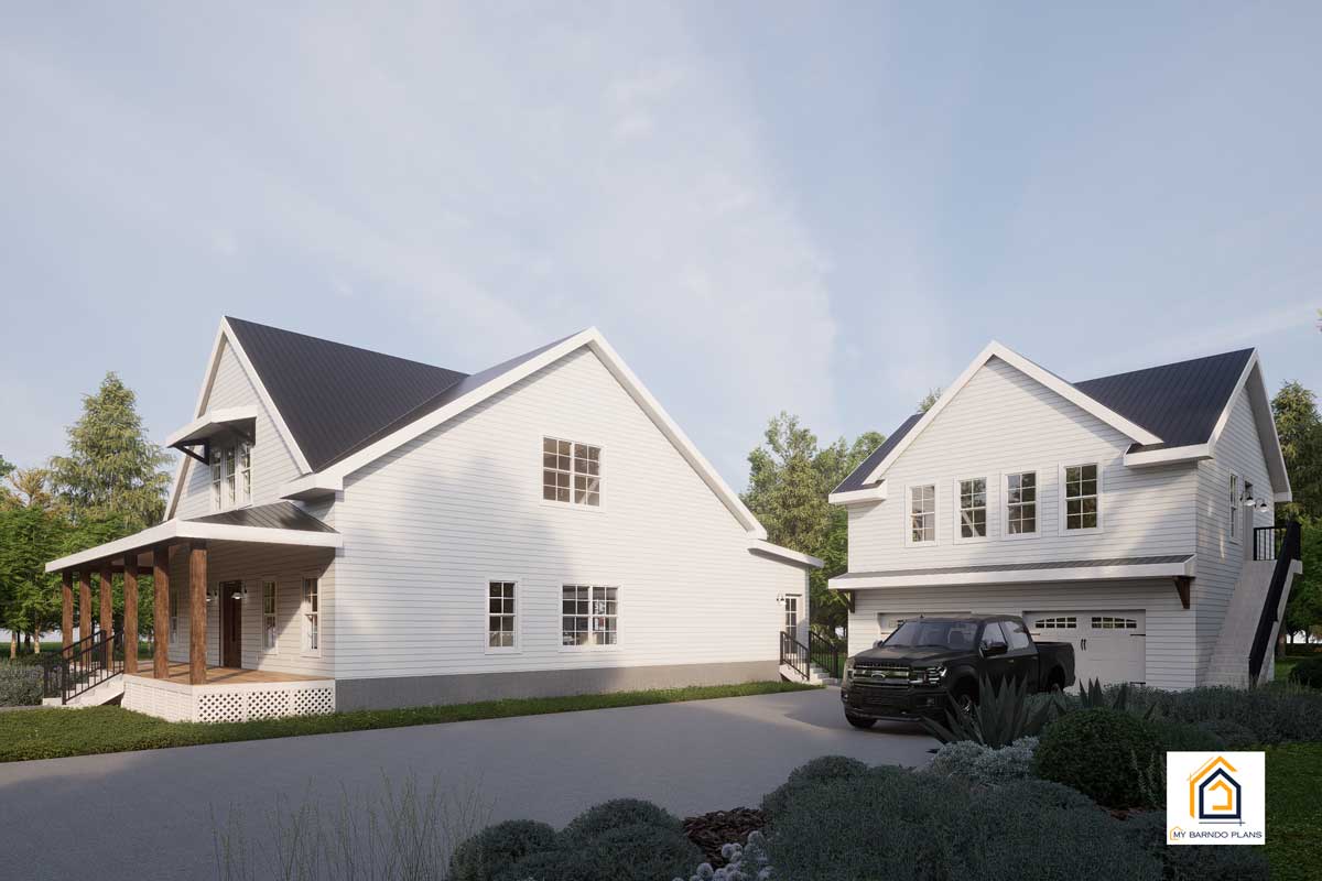 Full property view of the Palmetto Barndominium showing main home and garage apartment surrounded by landscaping