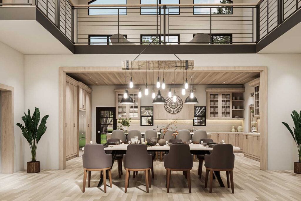 Inside the Ironwood barndominium with a view from the dining room table up into the loft