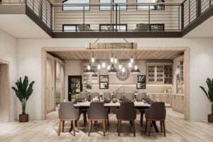 Inside the Ironwood barndominium with a view from the dining room table up into the loft