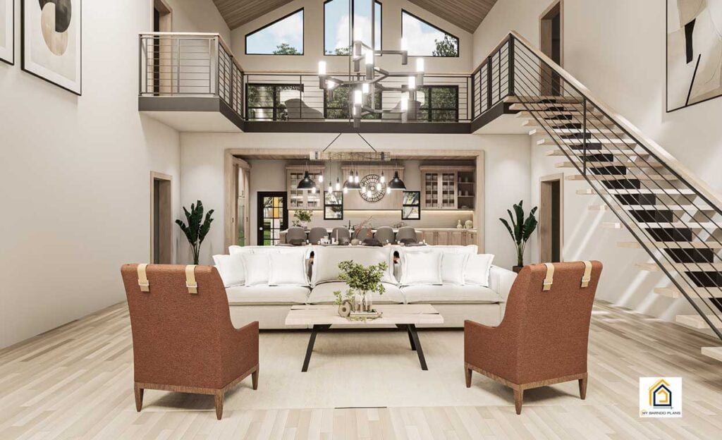 Ironwood Barndominium interior showing open living room with vaulted ceiling, loft railing, modern staircase, and kitchen beyond