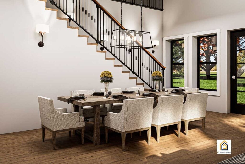 4 BR Table Rock barndominium plan dining area with staircase to loft and open two story living space