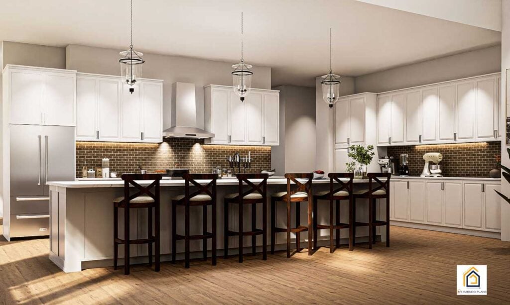 Table Rock barndominium kitchen with large island seating, white cabinets, pendant lighting, and open concept layout